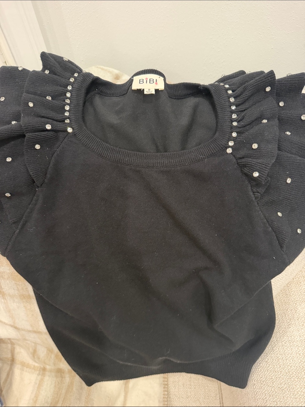 BiBi Black Ruffle Sleeve Sweater with Rhinestone Embellishments